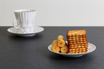 Cookies and defocused cup of tea