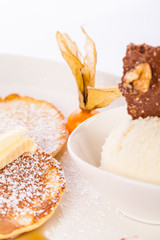 tasty sweet pancakes with vanilla icecream and topping