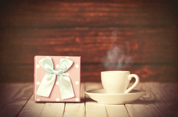 Cup of coffee and gift box