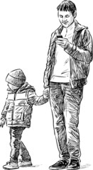 father and son on a walk