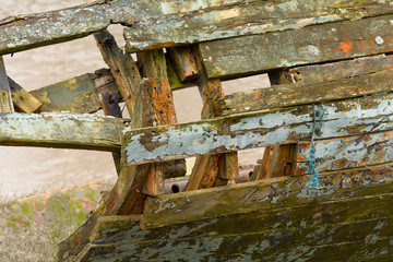 Derelict and rotting wooden hull of boat
