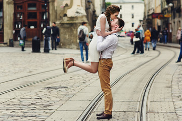 couple walk in old town lviv,kissing,loving