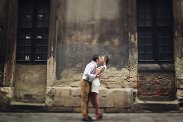 Fototapeta premium couple walk in old town lviv,kissing,loving