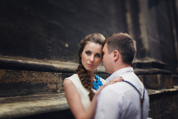 couple walk in old town lviv,kissing,loving