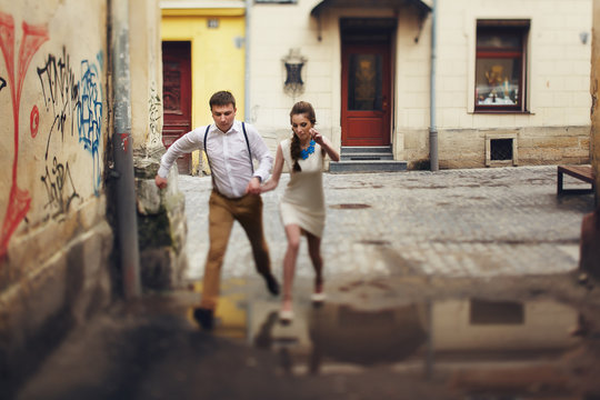 couple walk in old town lviv,kissing,loving. On the roof
