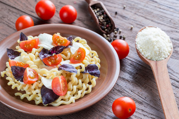 Fusilli lunghi with cheese and cherry tomatoes