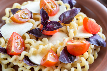 Fusilli lunghi with cheese and cherry tomatoes