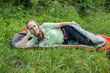 Woman lying in a sleeping bag