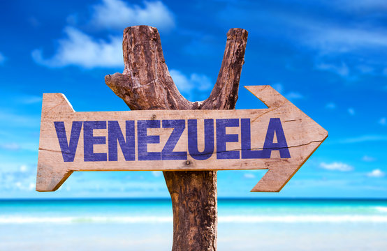 Venezuela wooden sign with beach background