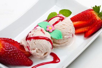 Strawberry ice cream with fruits close up