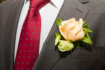 Boutonniere the groom in a suit