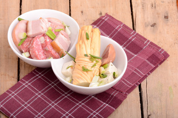 salami and cheese on white plate