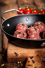 Meatballs on the pan with rustic background