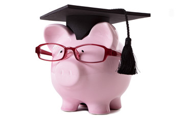 Graduate Piggy Bank or piggybank wearing college university cap and glasses isolated on white...