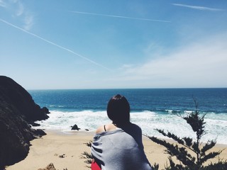 female looking at ocean