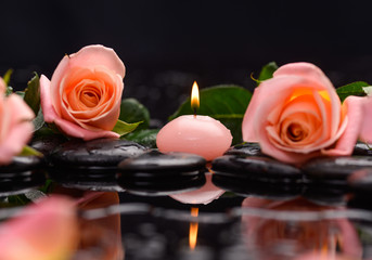 Orange rose ,leaf with candle and therapy stones 