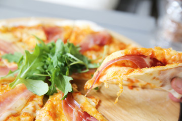 Pizza margherita with parma ham and rocket