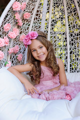 Little girl celebrate Happy Birthday Party with rose decor in th