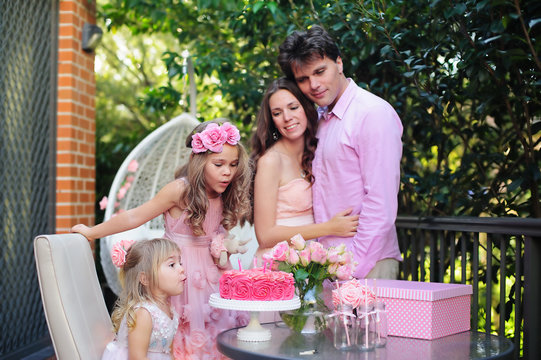 Family father, mother and children celebrate Happy Birthday