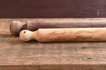 Wooden rolling pin on wooden board