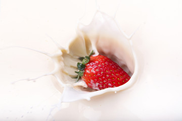 Strawberry splash on milk
