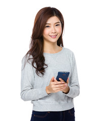 Young beautiful girl using mobile phone