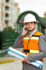 young handsome architect supervising a construction