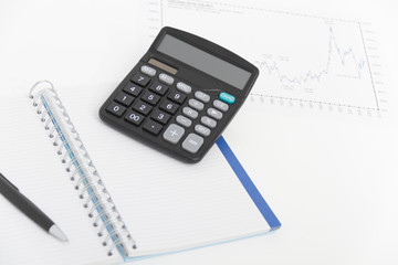 Business concept with calculator, pen and notebook