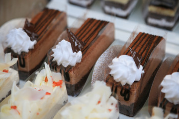 close-up sweet cake set on wooden table.