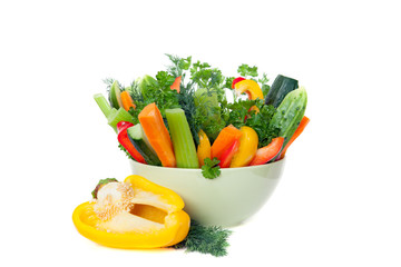 The raw vegetables in green bowl isolated on white background