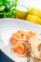 Sliced salted salmon served with bread