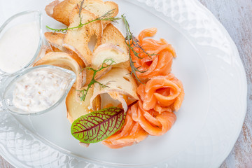 Sliced salted salmon served with bread