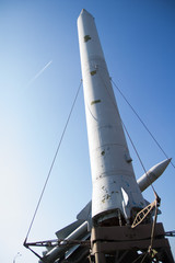 White rocket in the blue sky