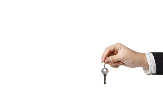 a business woman holding a key