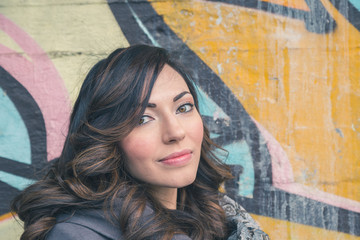 Fototapeta premium Beautiful girl posing in an urban context
