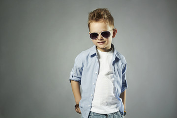 fashionable little boy in sunglasses.stylish child in jeans