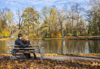 Cuddling couple on the bench