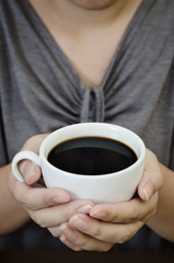 portraiture of a female holding coffee