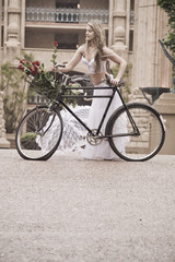 Plakat Young attractive woman outdoors with vintage bicycle