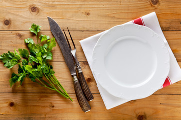 empty plate and carving knife and fork