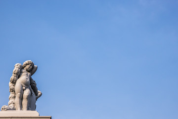 Angel statue art on fence of Throne Hall