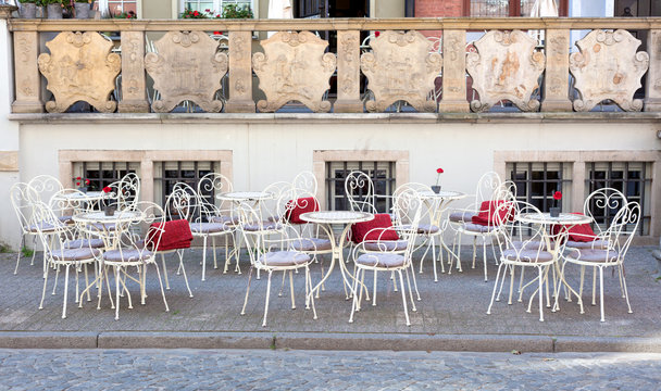 tables and chairs on the street