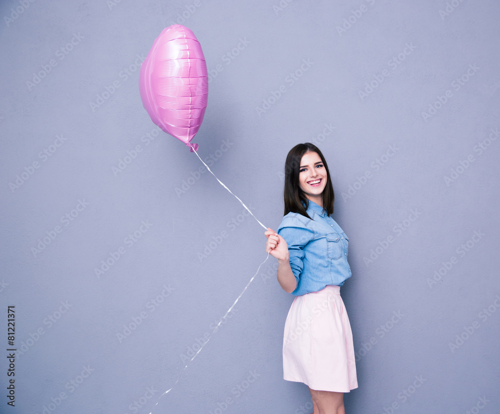 Sticker cheerful woman holding balloon and looking at camera