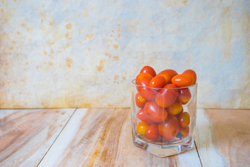 tomatoes on wooden background