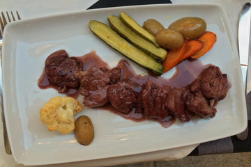 Pork with vegetable side on the plate