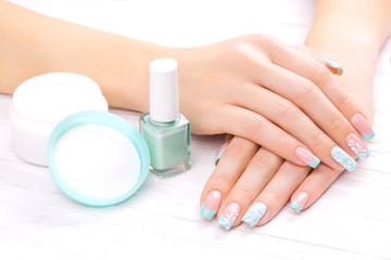 turquoise french manicure with light towel