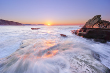 Naklejka premium Azkorri beach at sunset