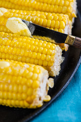hot golden corn cob with butter and salt