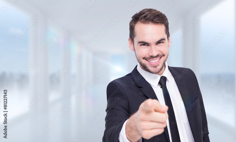 Aufkleber composite image of happy businessman pointing at camera