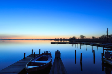 Tranquil, spring dawn in a small marina at a lake.